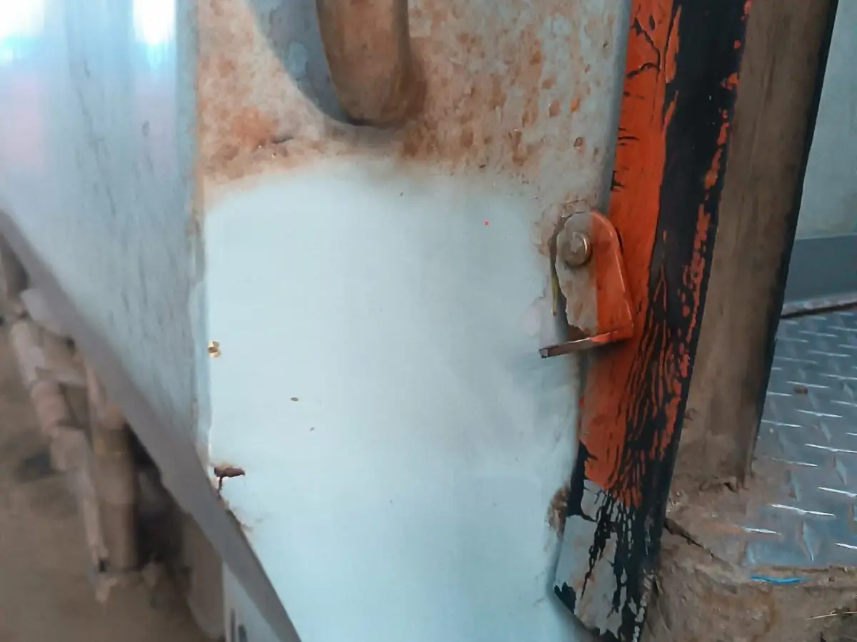 Indian Railways coach body corner with a patch cleaned by Nanoman Biocleaner