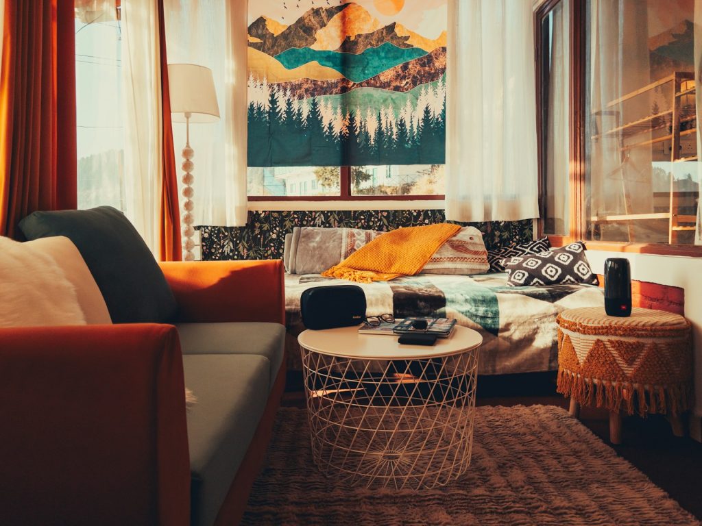 Living room with sofa, cushions and rug